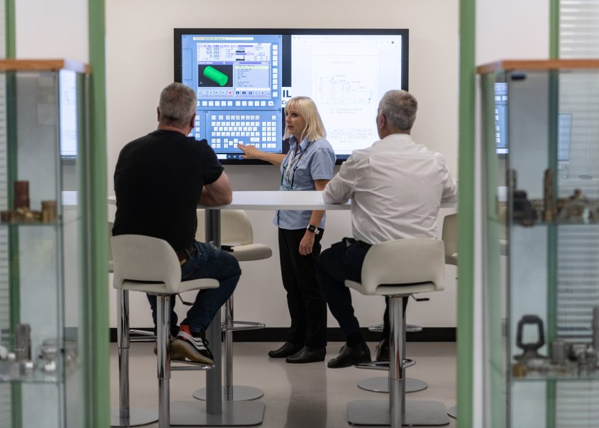 People attend a CNC training course