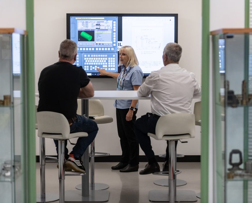 People attend a CNC training course